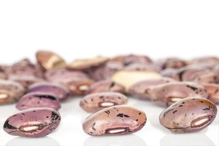 Lot of whole dried fresh speckled bean pinto isolated on white background