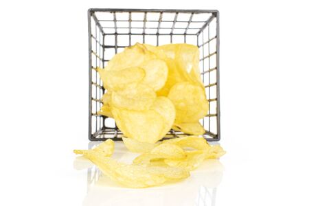 Lot of whole fried crisp potato chip in black plastic basket isolated on white backgroundの写真素材