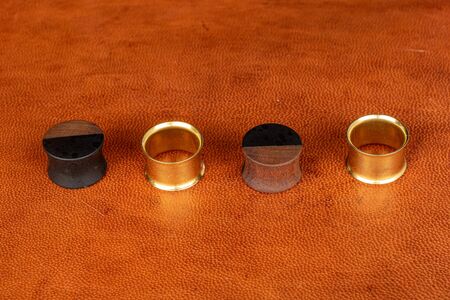 Group of four whole plug line on cognac leather