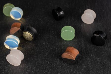 Lot of whole plug on grey stoneの写真素材