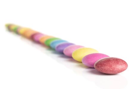 Lot of whole small sweet colourful candy isolated on white backgroundの写真素材