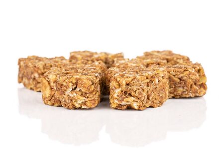 Lot of whole healthy brown cereal heart with cocoa isolated on white backgroundの写真素材