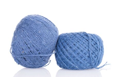 Group of two whole blue thread spool isolated on white