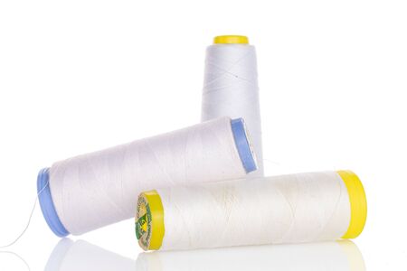 Group of three whole white thread spool isolated on white