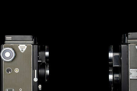Group of two whole vintage camera isolated on black glass