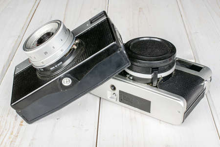 Group of two whole vintage camera on white wood