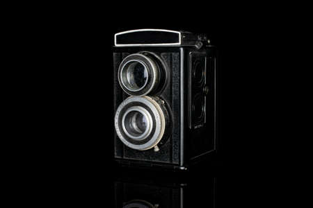 One whole vintage camera two lens isolated on black glassのeditorial素材