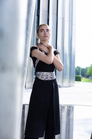 Young white model girl with city building background