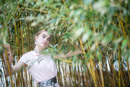 White young girl on the background of treesの写真素材