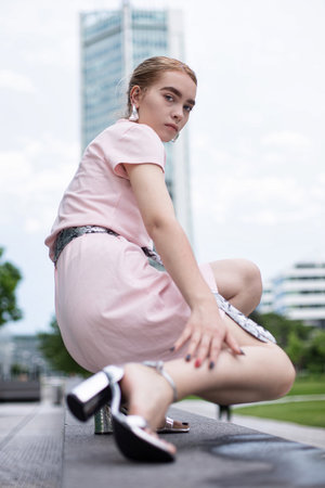 Young woman with blonde hair in cityの写真素材