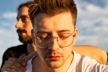 Young white european boys close-up portrait outside