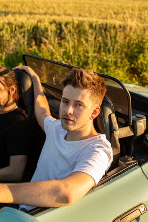 Young boy with blonde hair in the car