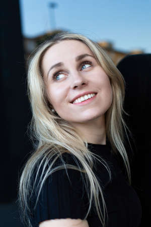 Smiling european white young woman portrait with blue eyes