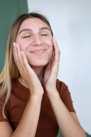Portrait woman with hand near the face partially green background