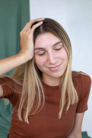 Portrait of a girl with closed eyes partially green background in studio