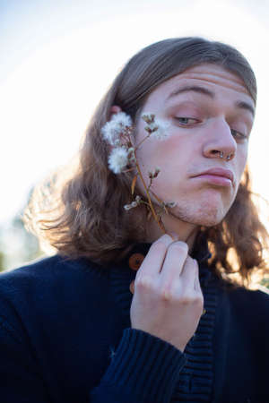 White european young man with long hair portraitの写真素材