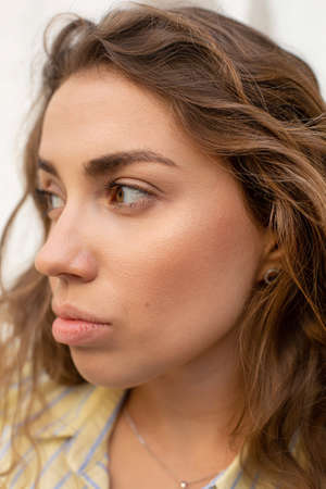Closeup portrait of young white girl with dark hair