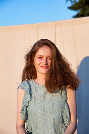 Smiling european young woman with bright makeup with red hair