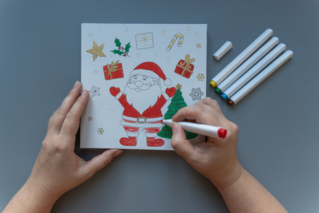 The adult woman painting a Christmas imageの写真素材