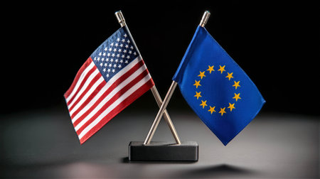 United States and European Union flags displayed together symbolizing international cooperation conceptの素材