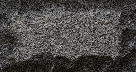 Close-up of rough granite stone texture background
