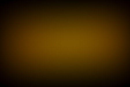Dark Gold Gradient Background with Soft Vignetteの写真素材