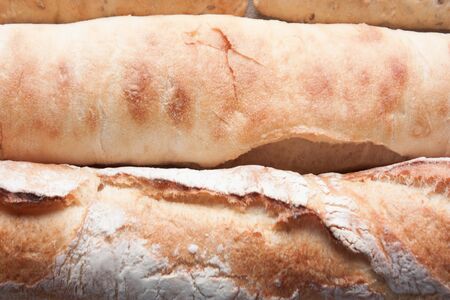 Two baguettes of gorizontal lines. Food background.