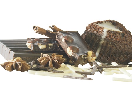 chocolates, cake and spices isolated on white background