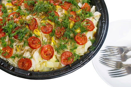 vegetable stew with tomatoes and greens isolated on whiteの写真素材