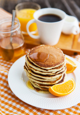 Stack of freshly prepared pancakes for breakfastの写真素材