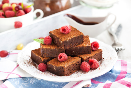 Homemade chocolate brownies decorated with fresh raspberryの写真素材