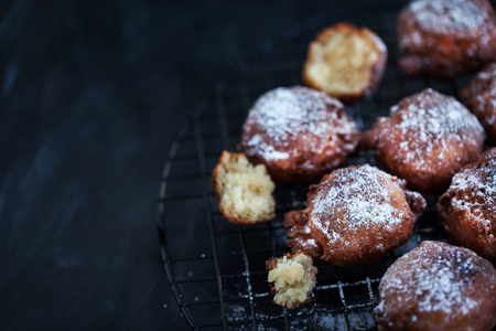Fresh delicious homemade warm apple fritters on darkの写真素材