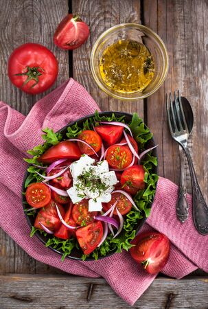 Fresh tomato and feta cheese salad, overheadの写真素材