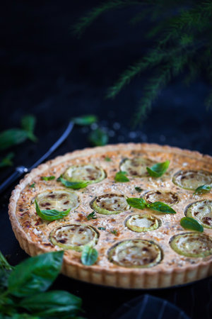 Delicious homemade zucchini, ricotta and feta cheese quiche ore tart (open pie)の写真素材
