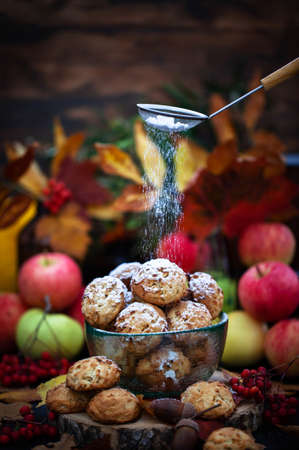 Homemade delicious apple cookies on rustic autumn backgroundの写真素材