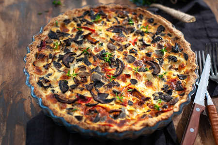 Delicious homemade mushrooms and cheese quiche ore tart (open pie)の写真素材