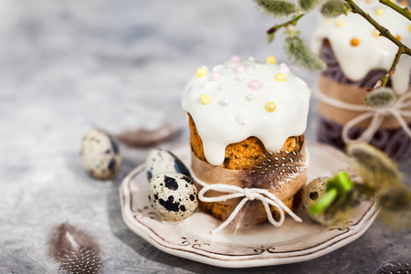 Sweet Easter bread, panettone or kulich and colorful painted eggs, Holiday spring concept