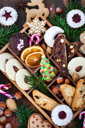 Sweet Christmas cookies in wooden box on rustic tableの写真素材