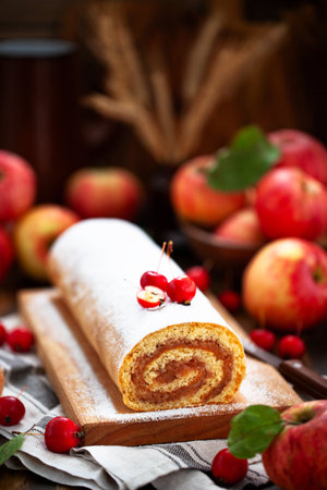 Homemade fresh baked delicious apple sponge roll cakeの写真素材