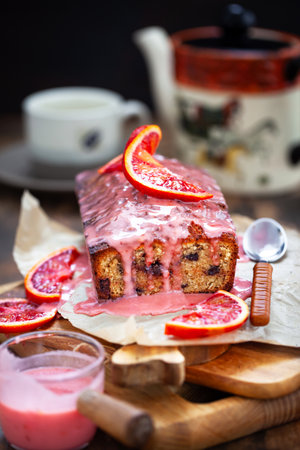 Blush orange and dark chocolate cake decorated with glazeの写真素材