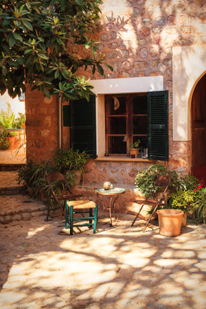 Picturesque view of a cozy courtyard in a small town in Mallorca, Spainの写真素材