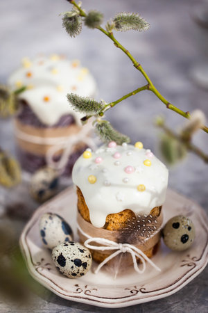Sweet Easter bread, panettone or kulich and colorful painted eggs, Holiday spring concept