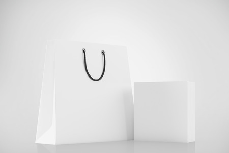 White blank box and shopping bag on a white background. Mock up. 3d renderingの写真素材