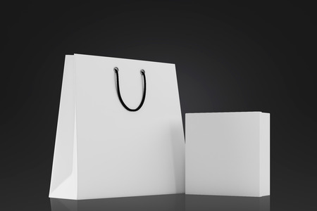 White blank box and shopping bag on a black background. Mock up. 3d renderingの写真素材