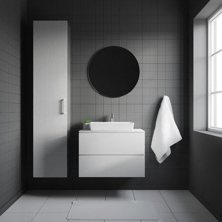Dark bathroom interior with white sink on a white shelf and with round mirror hanging above itの写真素材