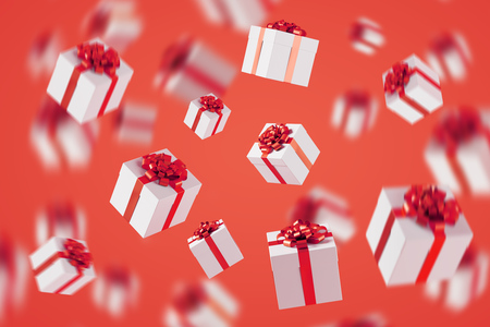 Lots of white gift boxes on red background.の写真素材