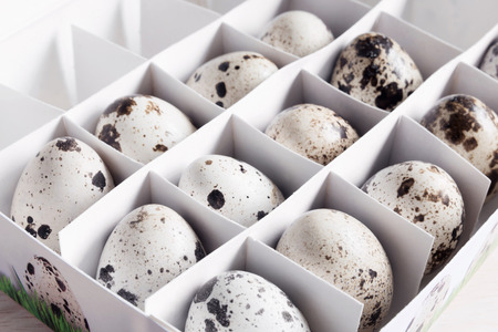 Box with quail eggs, raw ingredients