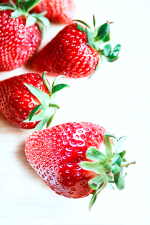 strawberries in a basket, summer colors in berries, background with strawberriesの写真素材
