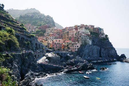 View on the colorful houses along the coastline of Cinque Terre area in Manarola.の写真素材
