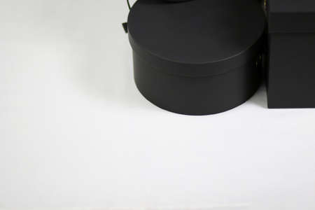 Black empty template round gift cardboard packaging box with closed lidの写真素材